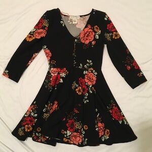 Black floral babydoll dress with 3/4 sleeves and button-up front